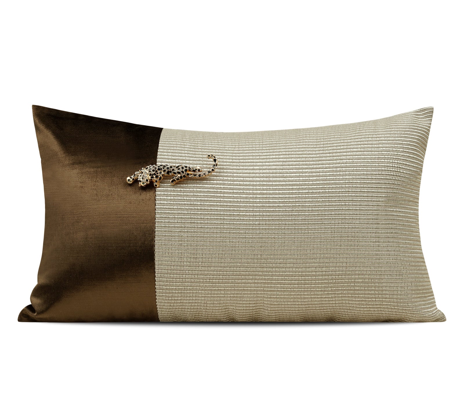 A rectangular decorative throw pillow with a split design: one half is smooth dark brown velvet, and the other half has a textured beige horizontal stripe pattern. A small jeweled animal embellishment sits near the top center.