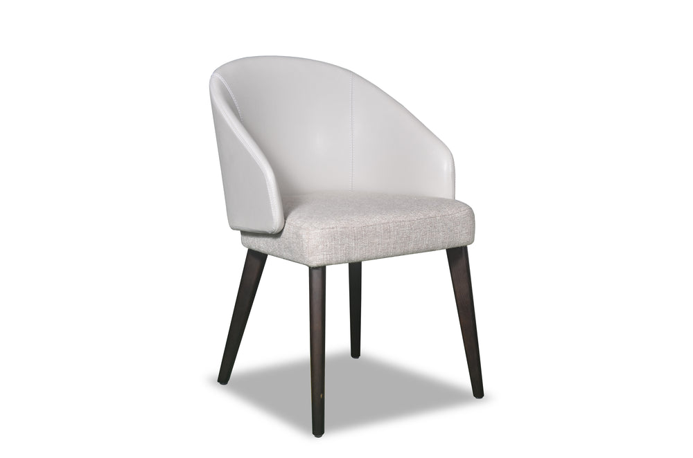 A white upholstered dining chair with a full back and seat, featuring dark brown wooden legs.