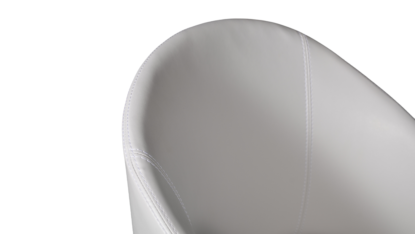 A white upholstered dining chair with a full back and seat, featuring dark brown wooden legs.