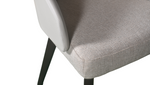 A white upholstered dining chair with a full back and seat, featuring dark brown wooden legs.