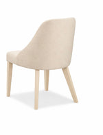 Beige chair with wooden legs on a white background