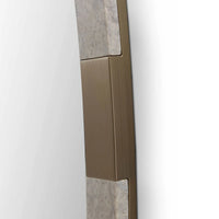 Close-up of a bronze door handle on a white door