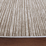 Close-up of a textured beige carpet on a wooden floor