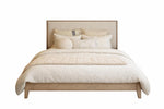 Beige bed with matching headboard and bedding on a white background