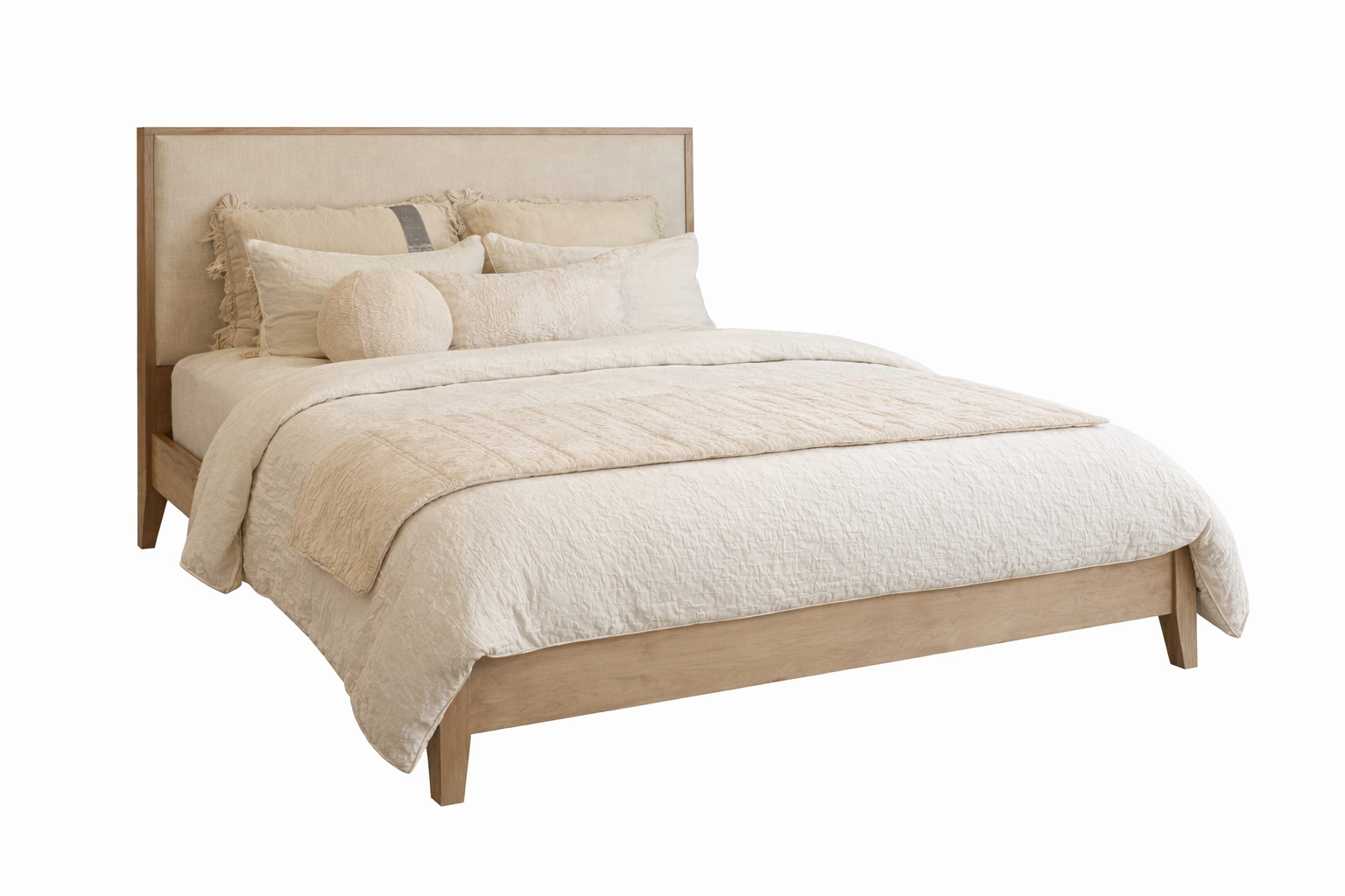 Beige bed with matching bedding on a white background