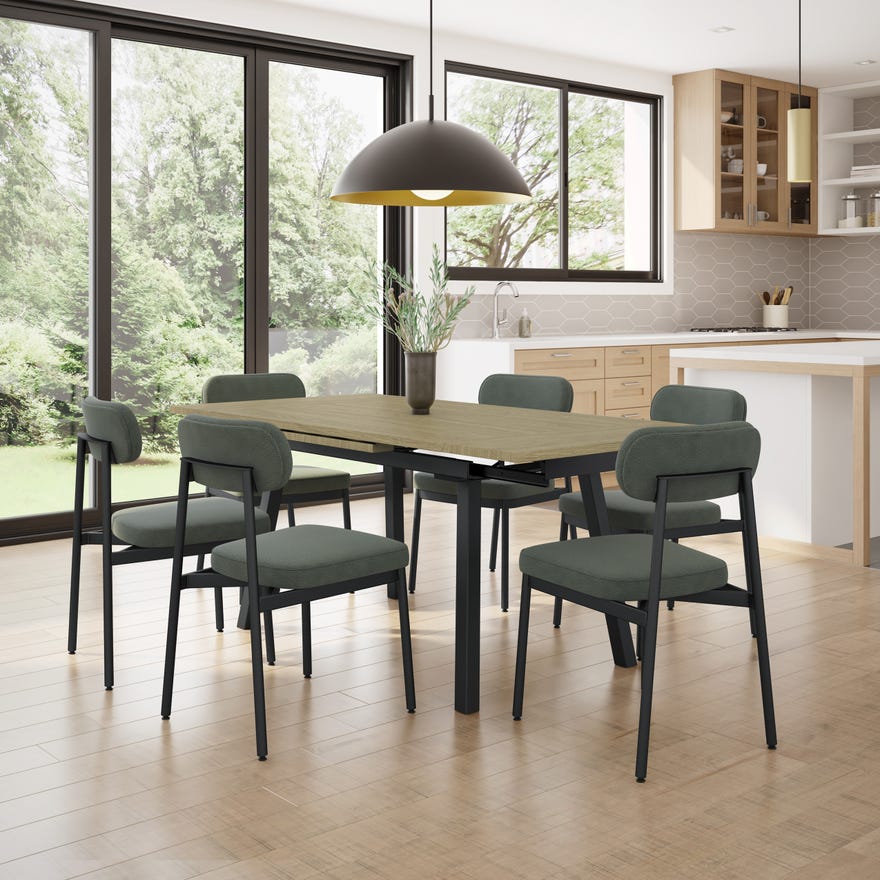 Dining area with a table and chairs in a modern kitchen.