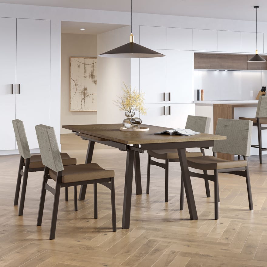 Dining area with a wooden table and chairs in a modern kitchen.