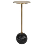 Side table with gold cylindrical top and black spherical base on a white background