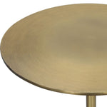 Round brass table top on a white background