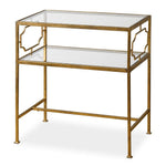 Gold-framed glass-top side table on a white background