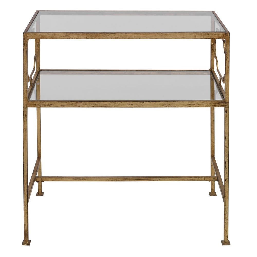 Two-tiered glass table with gold metal frame on a white background