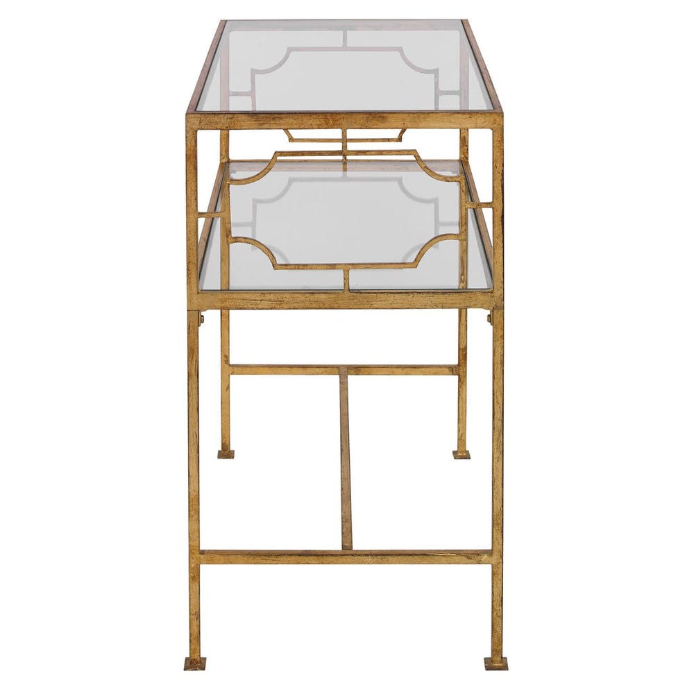 Gold metal side table with glass top on a white background