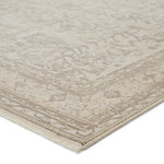Close-up of a textured beige rug with intricate patterns on a white background