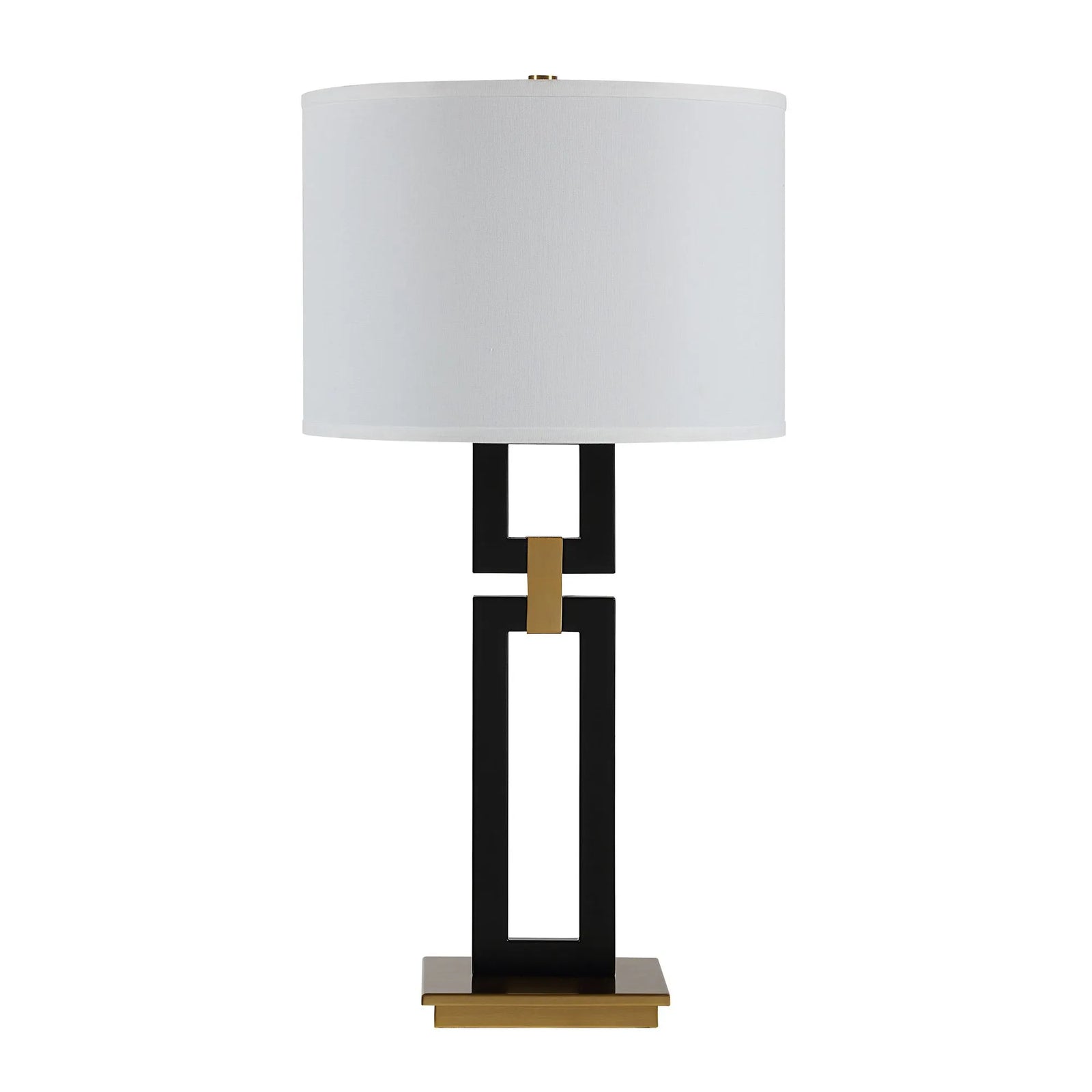 Table lamp with a white shade, black and gold base on a white background