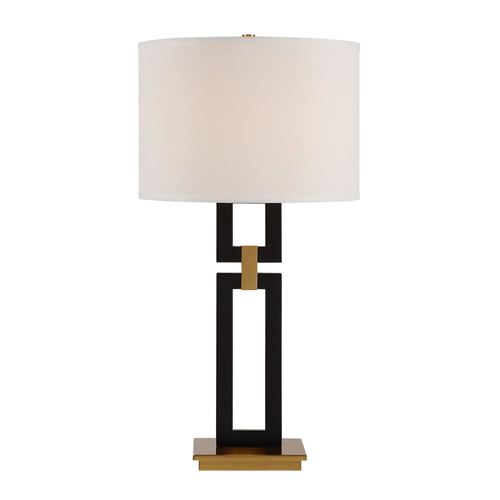 Table lamp with a black and gold base and white shade on a white background