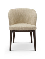 Beige upholstered chair with dark wooden legs on a white background