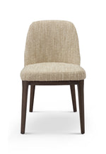 Beige upholstered chair with wooden legs on a white background