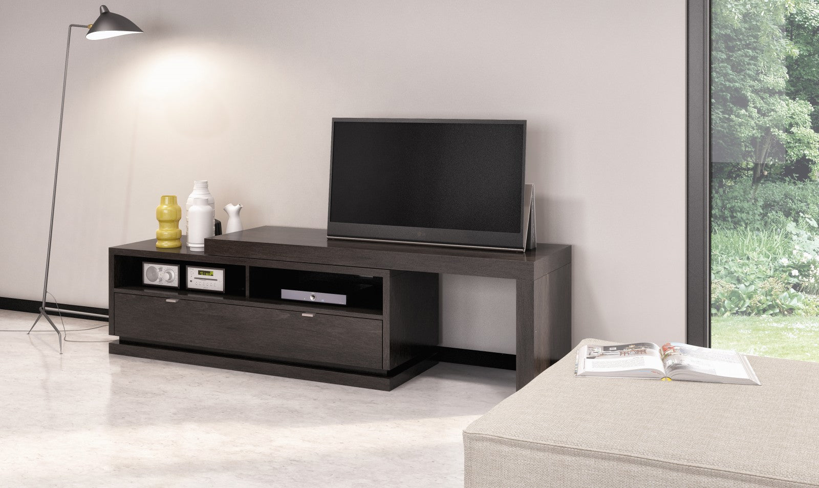 Modern living room with a TV on a wooden stand, lamp, and window view.