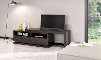 Modern living room with a TV on a wooden stand, lamp, and window view.