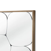 Decorative wall mirror with a wooden frame on a white background