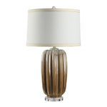 Table lamp with ribbed brown base and white shade on a white background