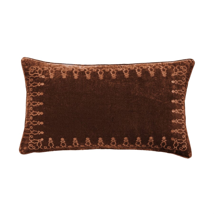 Brown decorative pillow with intricate patterns on a white background