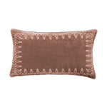 Brown pillow with decorative pattern on a white background