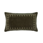 Dark brown pillow with decorative embroidery on a white background