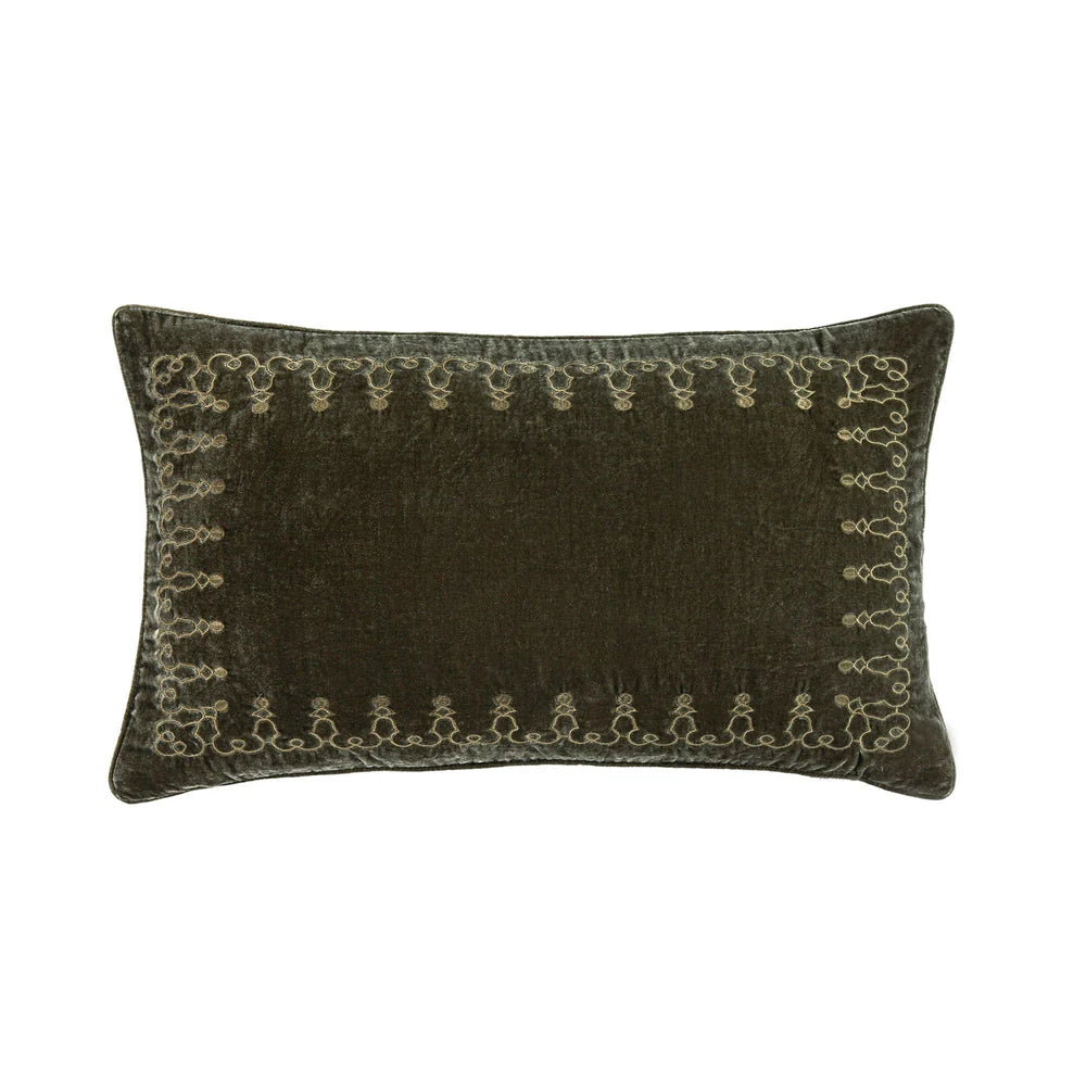 Dark brown pillow with decorative embroidery on a white background