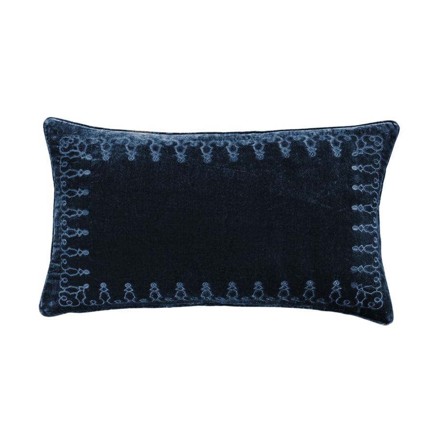 Navy blue decorative pillow with intricate patterns on a white background