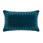 Teal decorative pillow with intricate pattern on a white background