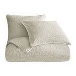 Light gray textured comforter and pillow set on a white background