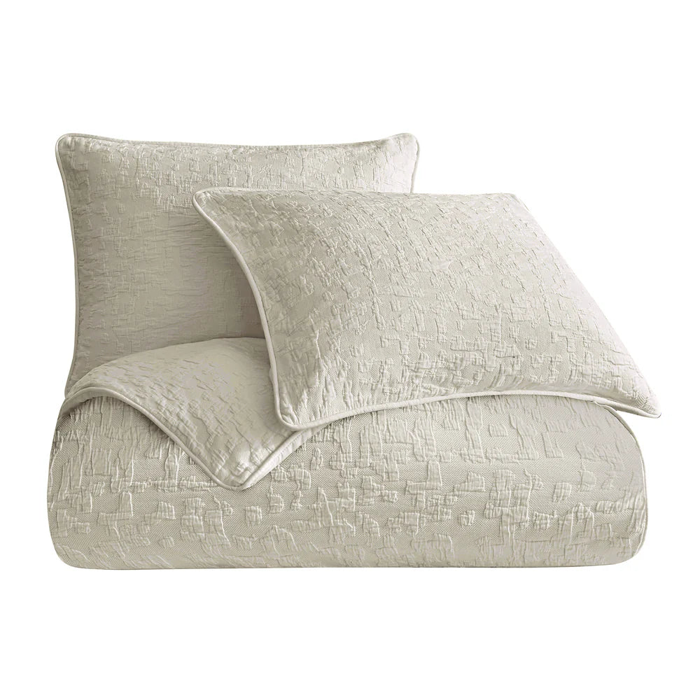Light gray textured comforter and pillow set on a white background