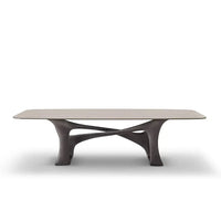 Modern coffee table with a unique base design on a white background