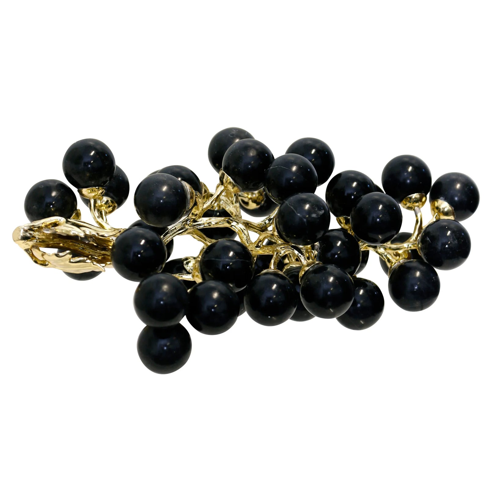 Black berry brooch with gold accents on a white background
