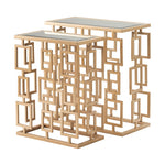 Two rectangular nesting tables with a gold geometric frame design and glass tops.