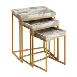 Set of three marble-top nesting tables with gold frames on a white background