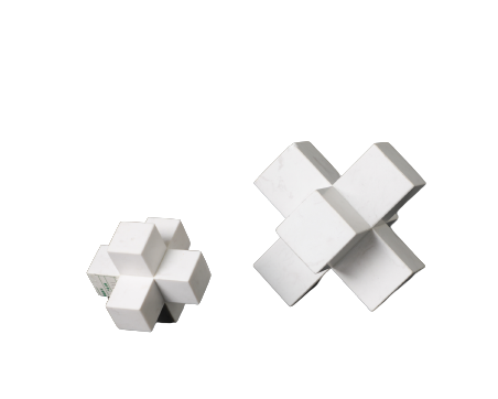 Two marble cubic decorative objects, one large and one small, with a white geometric pattern