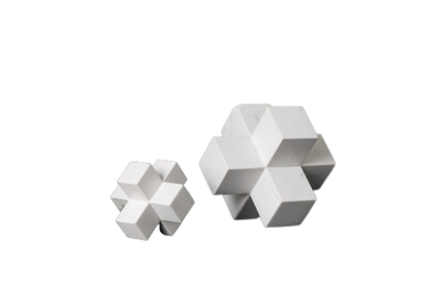 Two marble cubic decorative objects, one large and one small, with a white geometric pattern
