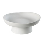 White ceramic pedestal bowl on a white background