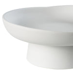 White ceramic pedestal bowl on a white background