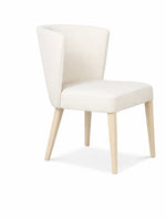 White chair with light wood legs on a white background
