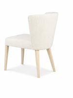 White upholstered chair with light wood legs on a white background