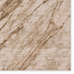 Textured beige and brown area rug with wavy pattern