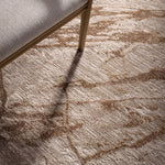 Patterned carpet with a chair leg partially visible