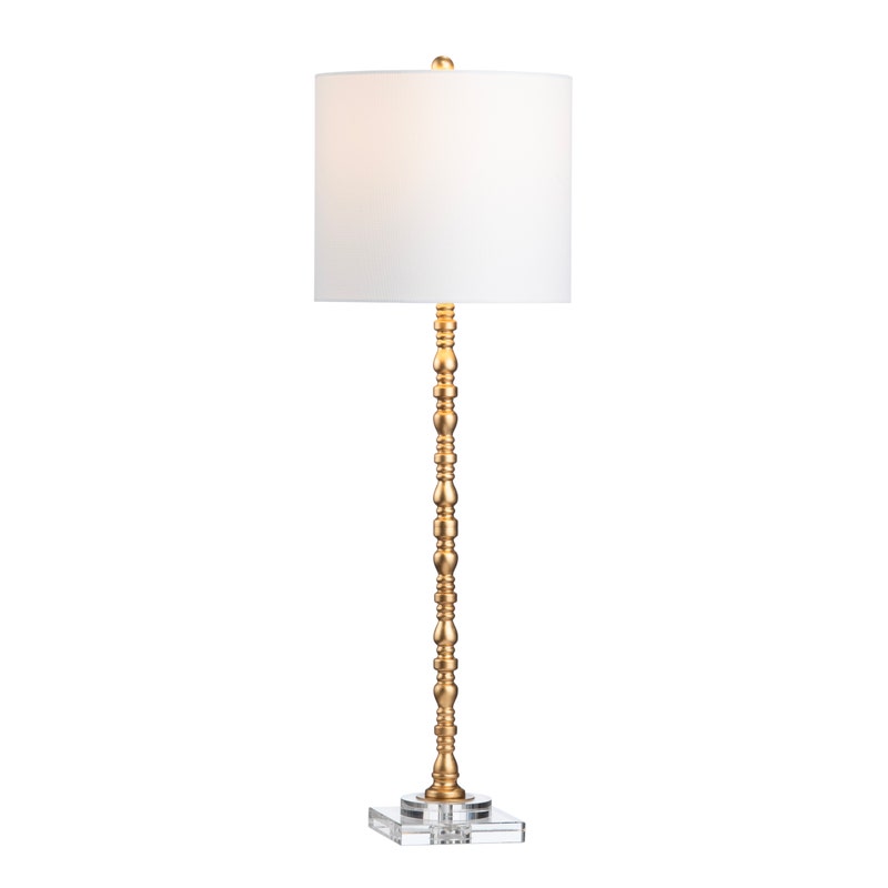 A brass table lamp with a white shade, featuring a twisted stem design on a crystal base.