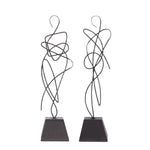 Two cast aluminum statues with an oil rubbed bronze finish on a black base, in a minimalist design, portraying abstract curvilinear forms.