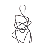 Close-up to a cast aluminum statues with an oil rubbed bronze finish on a black base, in a minimalist design, portraying abstract curvilinear forms.