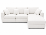 White sectional sofa with cushions on a white background