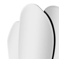 Close-up of a white ceramic bowl with a black interior on a white background